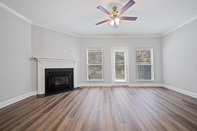 unfurnished living room with hardwood / wood-style flooring, ornamental molding, and ceiling fan