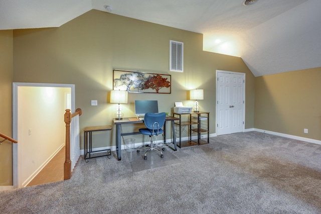 home office featuring lofted ceiling and carpet floors