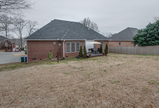 rear view of house with a lawn