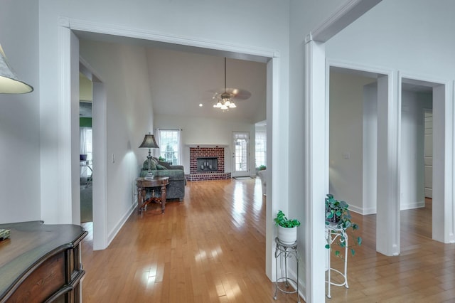 corridor with light hardwood / wood-style floors