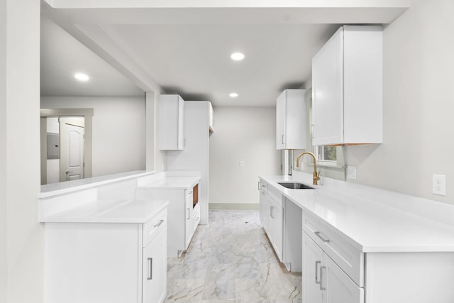 kitchen with sink and white cabinets