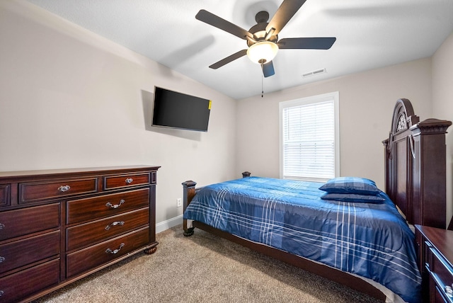 bedroom featuring light colored carpet and ceiling fan
