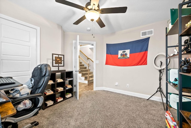home office featuring carpet floors and ceiling fan