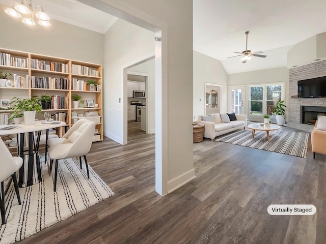 interior space featuring ceiling fan with notable chandelier, high vaulted ceiling, and dark hardwood / wood-style floors