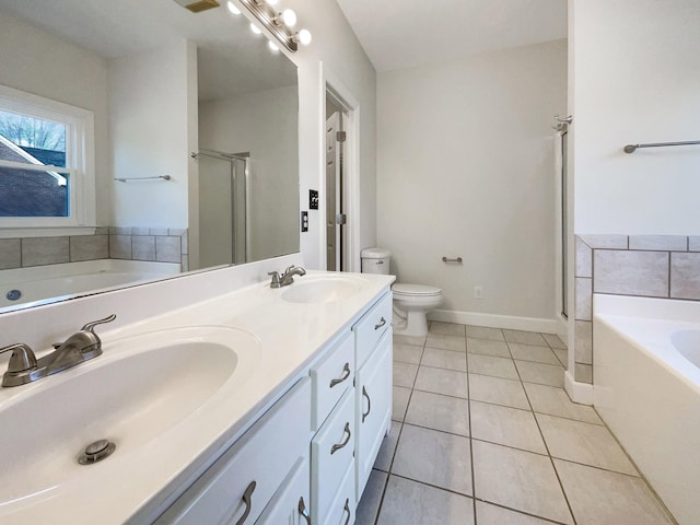 full bathroom with tile patterned flooring, vanity, separate shower and tub, and toilet