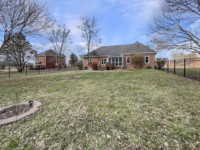 back of house with a lawn