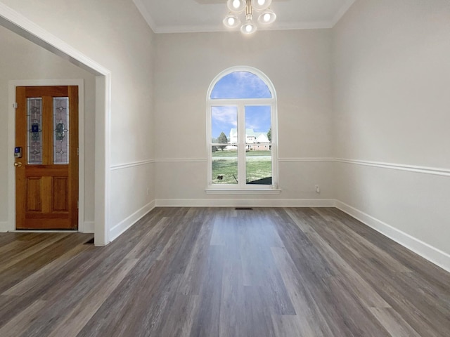 unfurnished room with dark wood-type flooring and ornamental molding