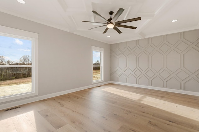 spare room with coffered ceiling, ceiling fan, ornamental molding, and light wood-type flooring