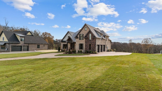 view of front facade with a garage and a front lawn