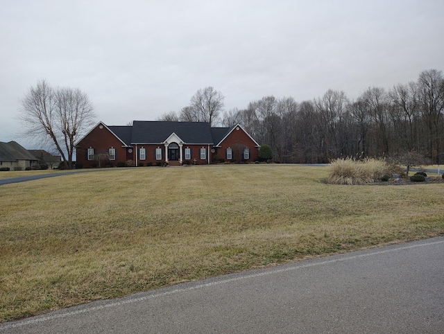 single story home featuring a front yard