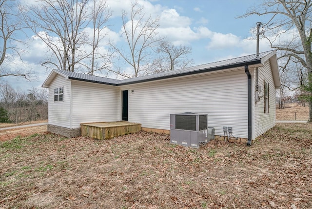 rear view of house with cooling unit