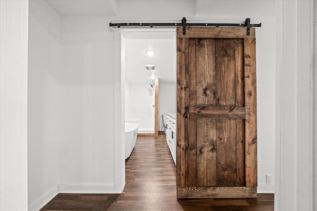 bathroom with a bathtub and wood-type flooring