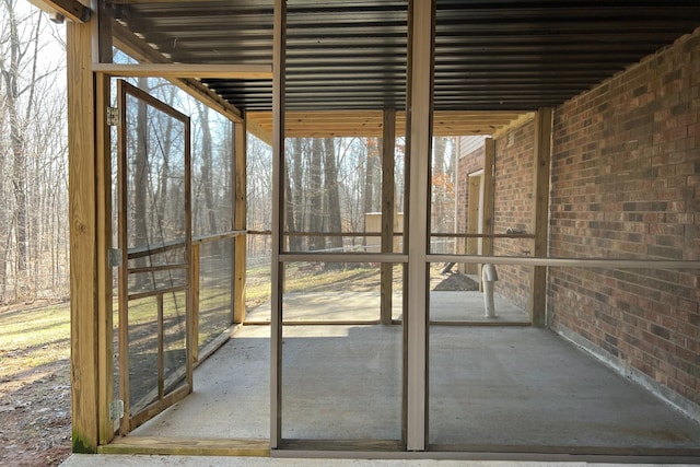 unfurnished sunroom with plenty of natural light