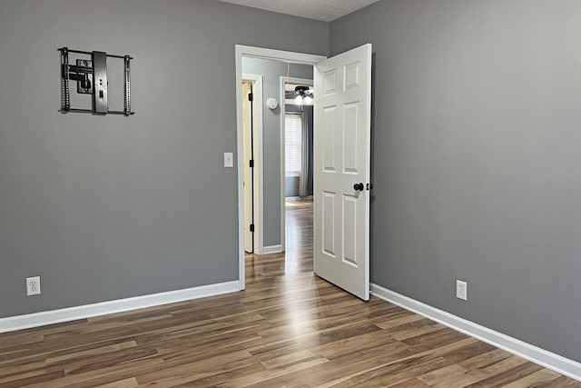 unfurnished room featuring hardwood / wood-style flooring