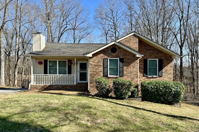 view of front of property with a porch and a front yard