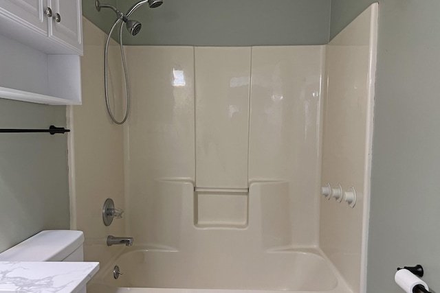 full bathroom featuring vanity, bathtub / shower combination, and toilet