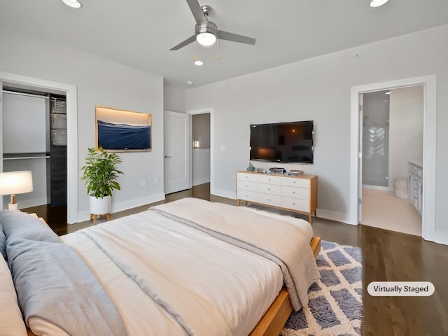 bedroom with dark hardwood / wood-style floors and ceiling fan