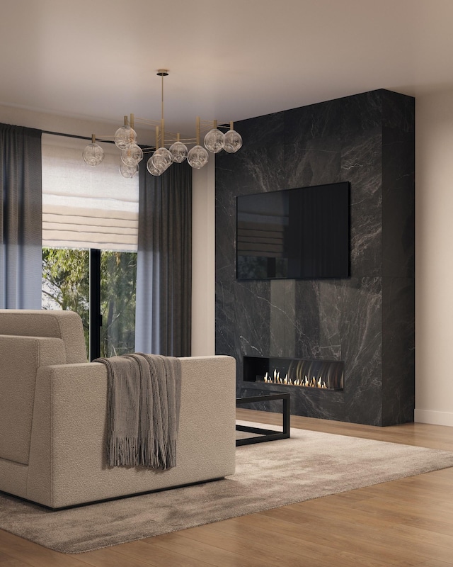 living room with wood-type flooring and a fireplace