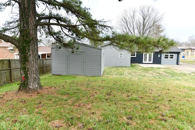 118 Rainbow St, Clarksville, TN 37042 - exterior space featuring a storage unit, fence, french doors, and an outdoor structure