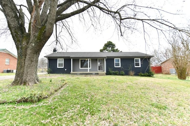 ranch-style house featuring a front yard and central AC unit