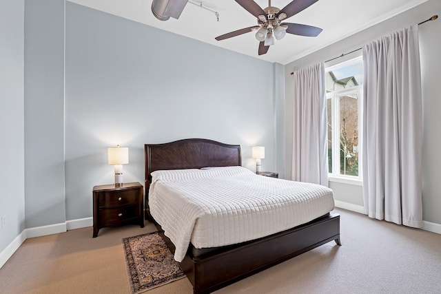 bedroom with light carpet and ceiling fan