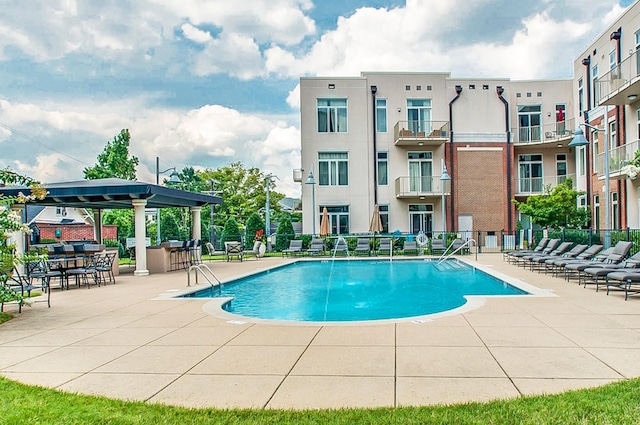 view of swimming pool featuring a patio area