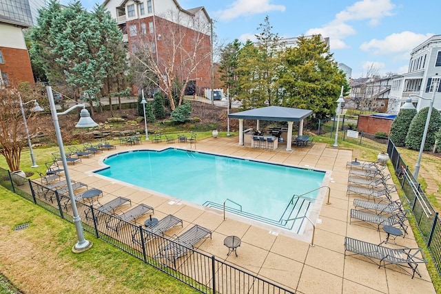 view of swimming pool with a gazebo and a patio area