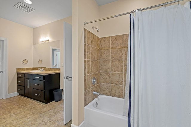 bathroom with vanity and shower / tub combo