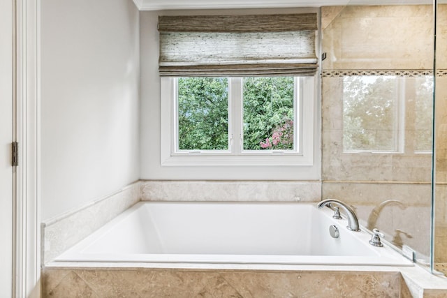 bathroom featuring tiled bath