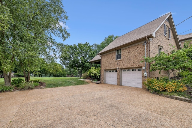 view of property exterior with a garage and a lawn