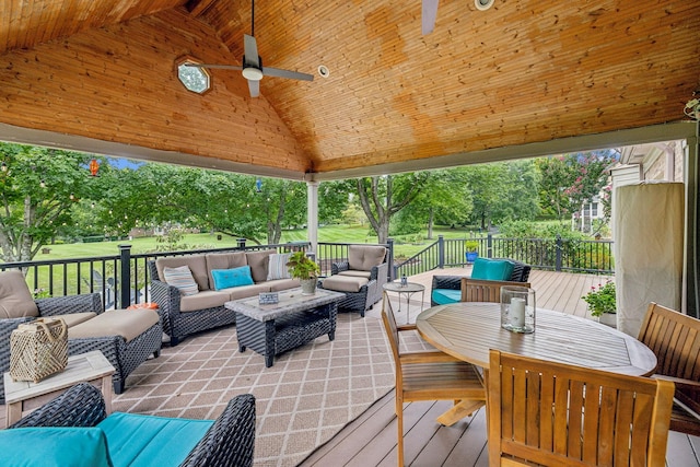 wooden deck with ceiling fan and outdoor lounge area