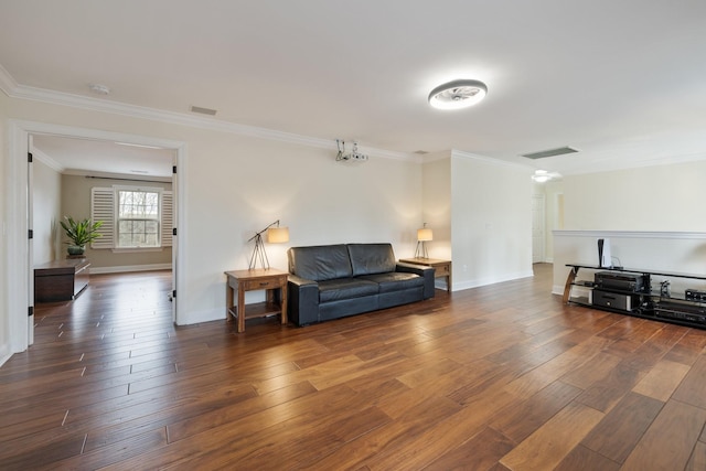 living room with ornamental molding and dark hardwood / wood-style floors