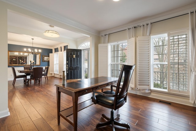 home office featuring hardwood / wood-style flooring, ornamental molding, and a notable chandelier