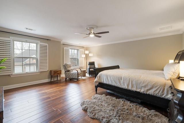 bedroom with crown molding, ceiling fan, and dark hardwood / wood-style flooring