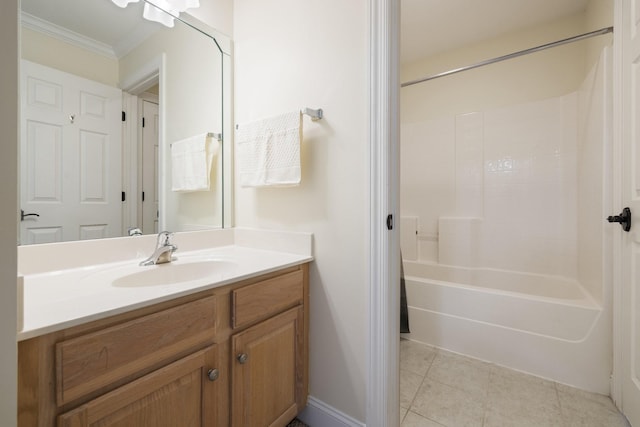 bathroom featuring ornamental molding, tile patterned flooring, shower / bathing tub combination, and vanity