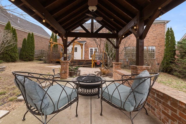 view of patio / terrace featuring a gazebo and an outdoor fire pit