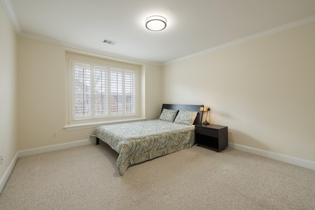 bedroom with ornamental molding and carpet flooring