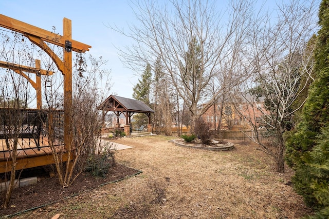 view of yard featuring a gazebo and a wooden deck