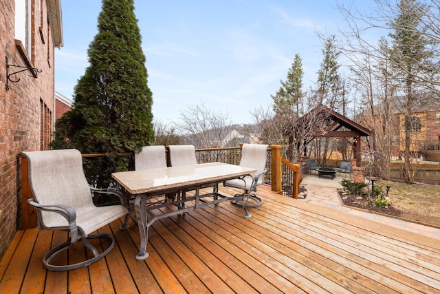 wooden deck featuring a gazebo