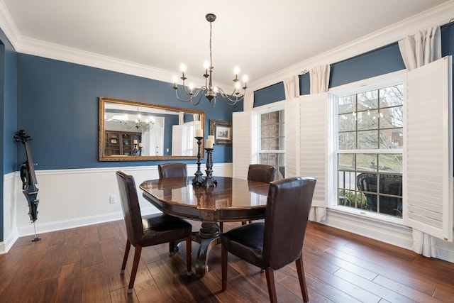 dining space featuring dark hardwood / wood-style flooring, plenty of natural light, and ornamental molding