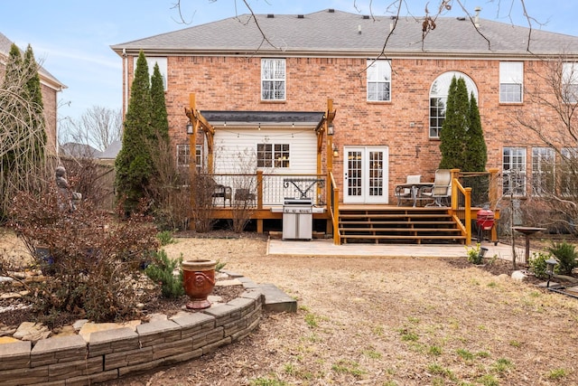 rear view of house featuring a deck