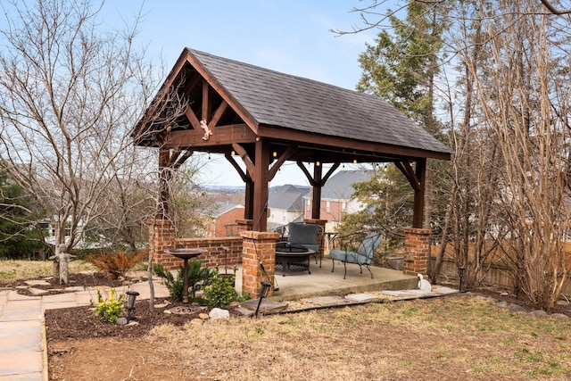 view of yard featuring a gazebo, an outdoor fire pit, and a patio