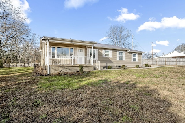 back of house featuring a porch and a yard