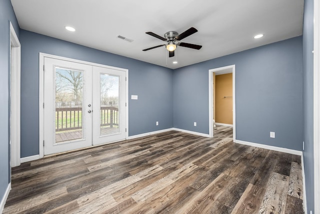 empty room featuring french doors, ceiling fan, and dark hardwood / wood-style floors