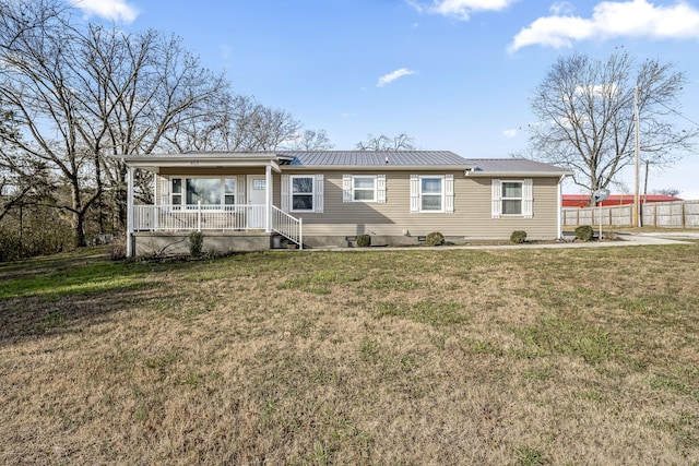 ranch-style house featuring a porch and a front yard