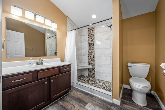 bathroom featuring a shower with curtain, vanity, toilet, and hardwood / wood-style flooring