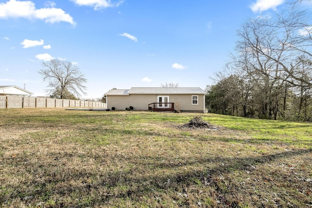 rear view of house with a yard