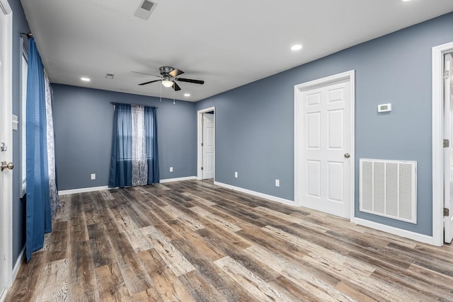 unfurnished room featuring ceiling fan and wood-type flooring