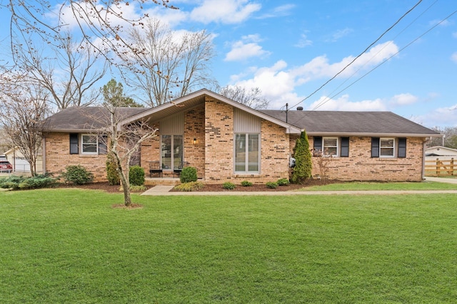 ranch-style house featuring a front lawn