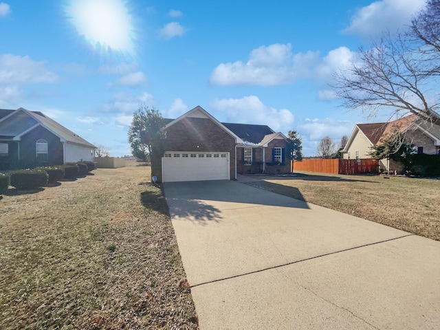 view of front of house with a garage and a front yard